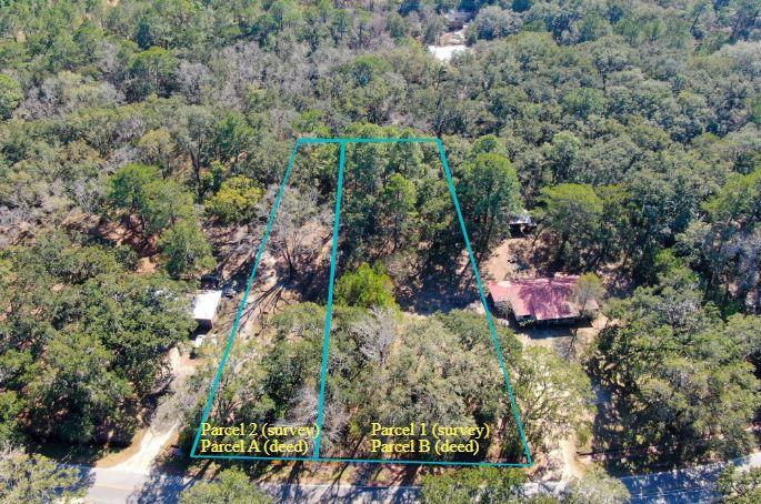 2-parcels Bay Grove Road Freeport, FL 32439 - Photo 1 of 10 a view of a wooden house with a yard