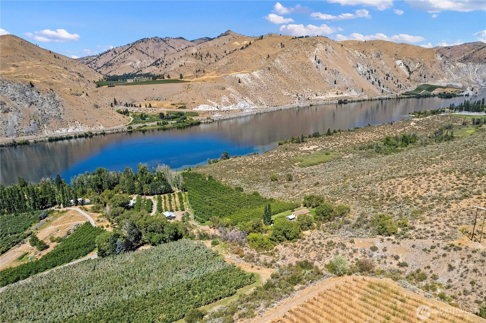 106 Silvest Road Orondo, WA 98843 - Photo 1 of 38 a view of a yard with a lake view