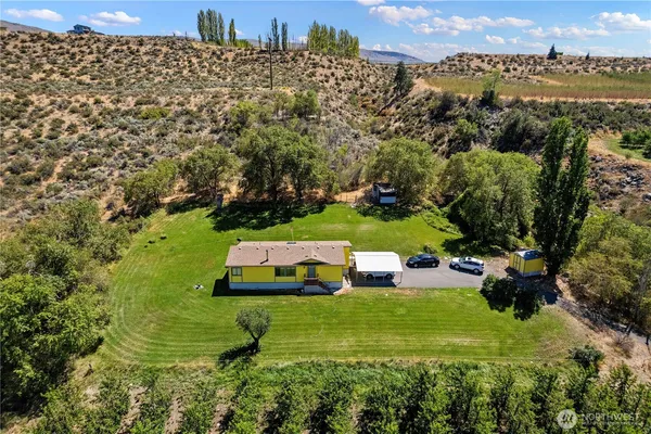 a aerial view of a house with a big yard