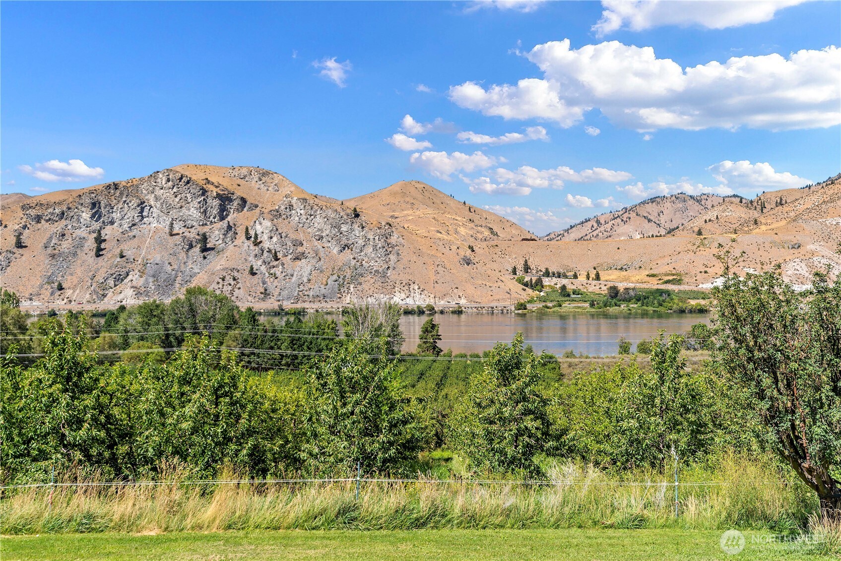 106 Silvest Road Orondo, WA 98843 - Photo 13 of 38 a view of a lake with mountains in the background