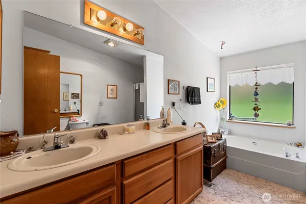 a bathroom with a double sink and a mirror