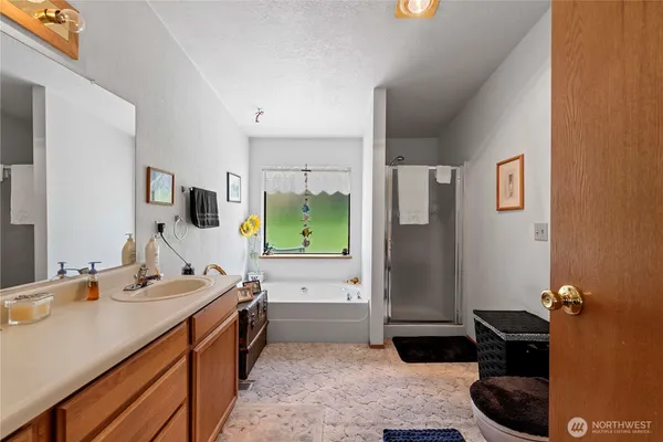a en suite bathroom with sink and mirror