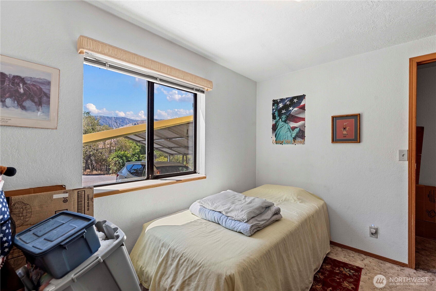 106 Silvest Road Orondo, WA 98843 - Photo 30 of 38 a bedroom with a bed and wooden floor