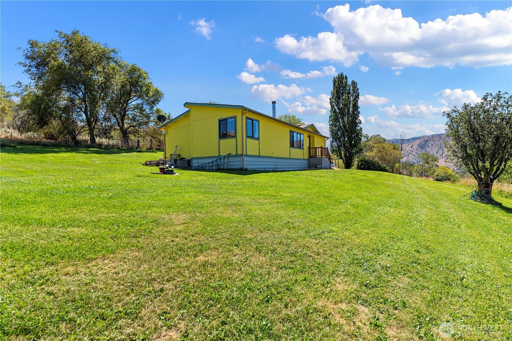 106 Silvest Road Orondo, WA 98843 - Photo 33 of 38 a view of a big yard with swimming pool and green space