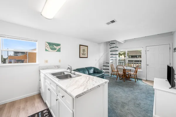 a kitchen that has a cabinets and a stove