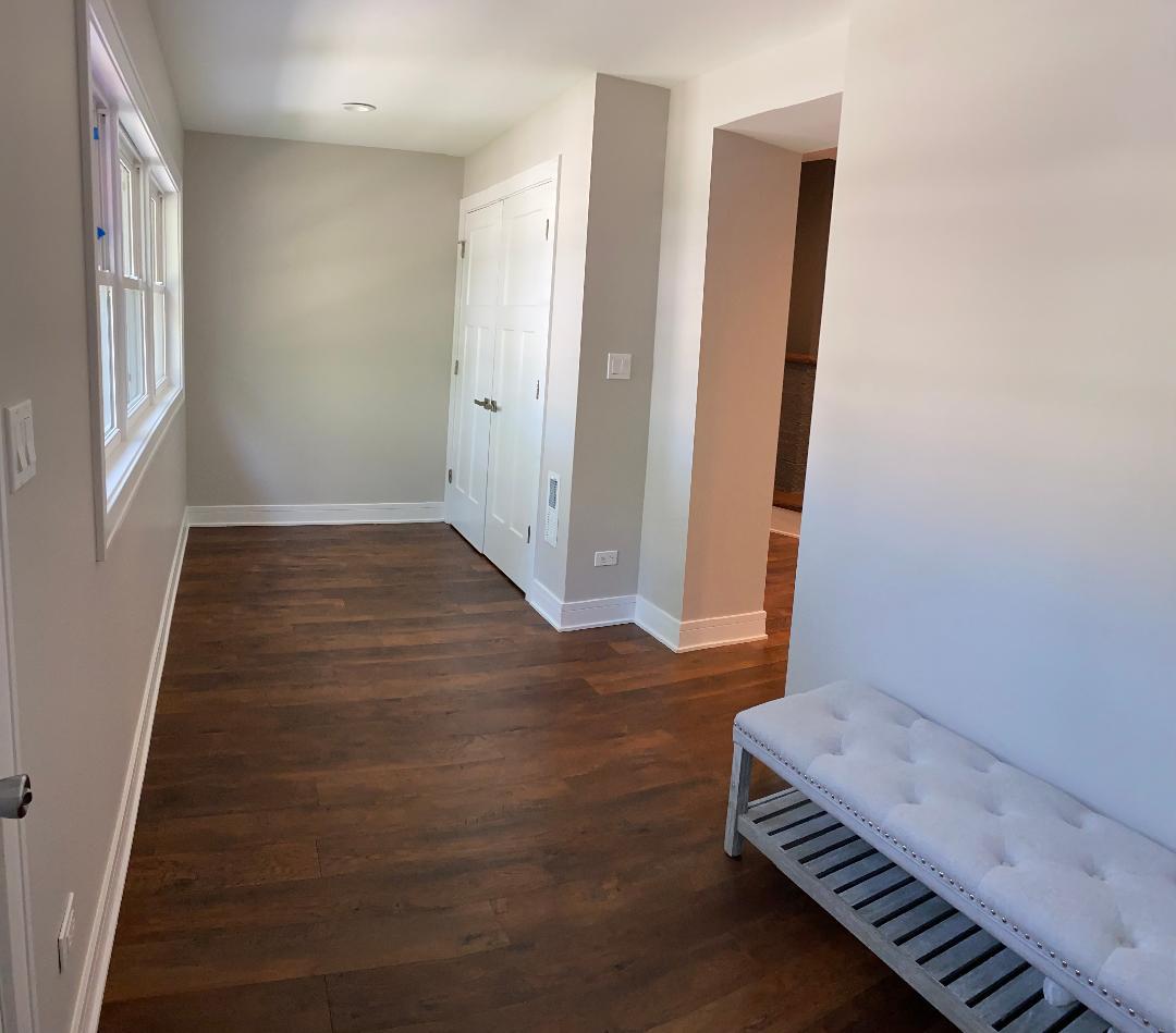 8211 43rd Place Lyons, IL 60534 - Photo 2 of 25 a view of room with wooden floor and stairs
