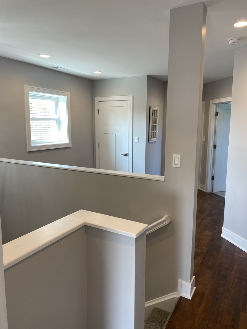 8211 43rd Place Lyons, IL 60534 - Photo 15 of 25 a view of a hallway with wooden floor