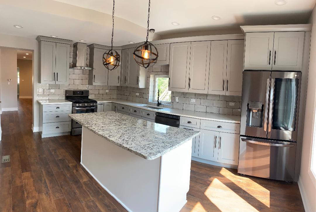 8211 43rd Place Lyons, IL 60534 - Photo 8 of 25 a kitchen with granite countertop stainless steel appliances a counter space and cabinets