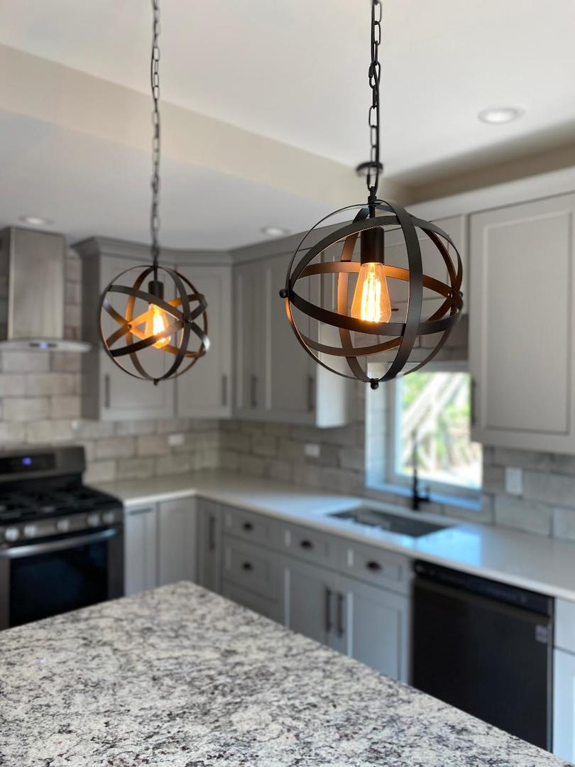 8211 43rd Place Lyons, IL 60534 - Photo 10 of 25 a kitchen with stainless steel appliances granite countertop a stove a sink and a microwave