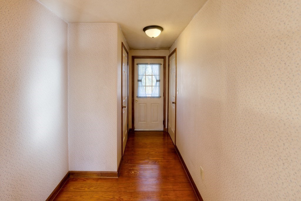 42 Waid Road Monson, MA 01057 - Photo 12 of 39 a view of a hallway with wooden floor