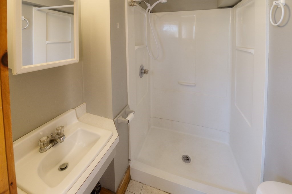42 Waid Road Monson, MA 01057 - Photo 27 of 39 a bathroom with a sink and a mirror