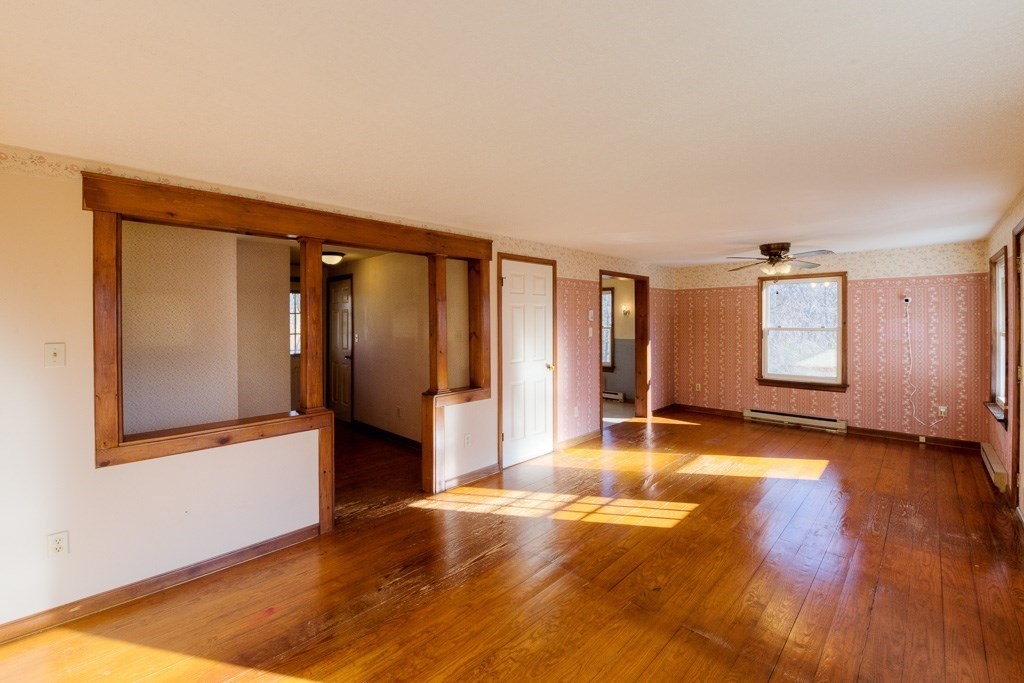 42 Waid Road Monson, MA 01057 - Photo 3 of 39 a view of an empty room with window and wooden floor