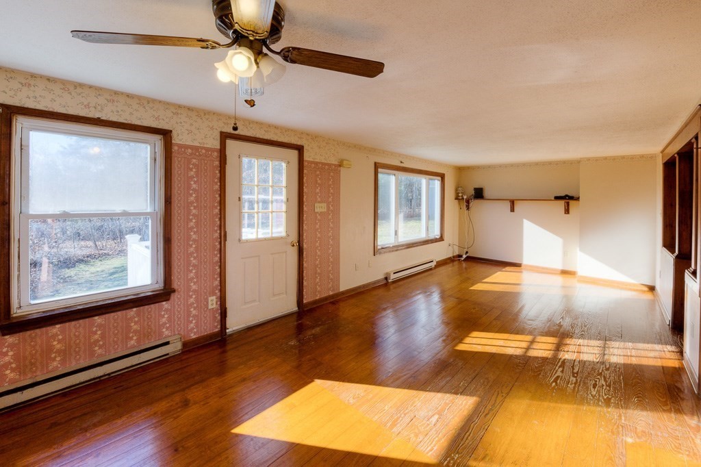 42 Waid Road Monson, MA 01057 - Photo 8 of 39 a view of an empty room with window and wooden floor