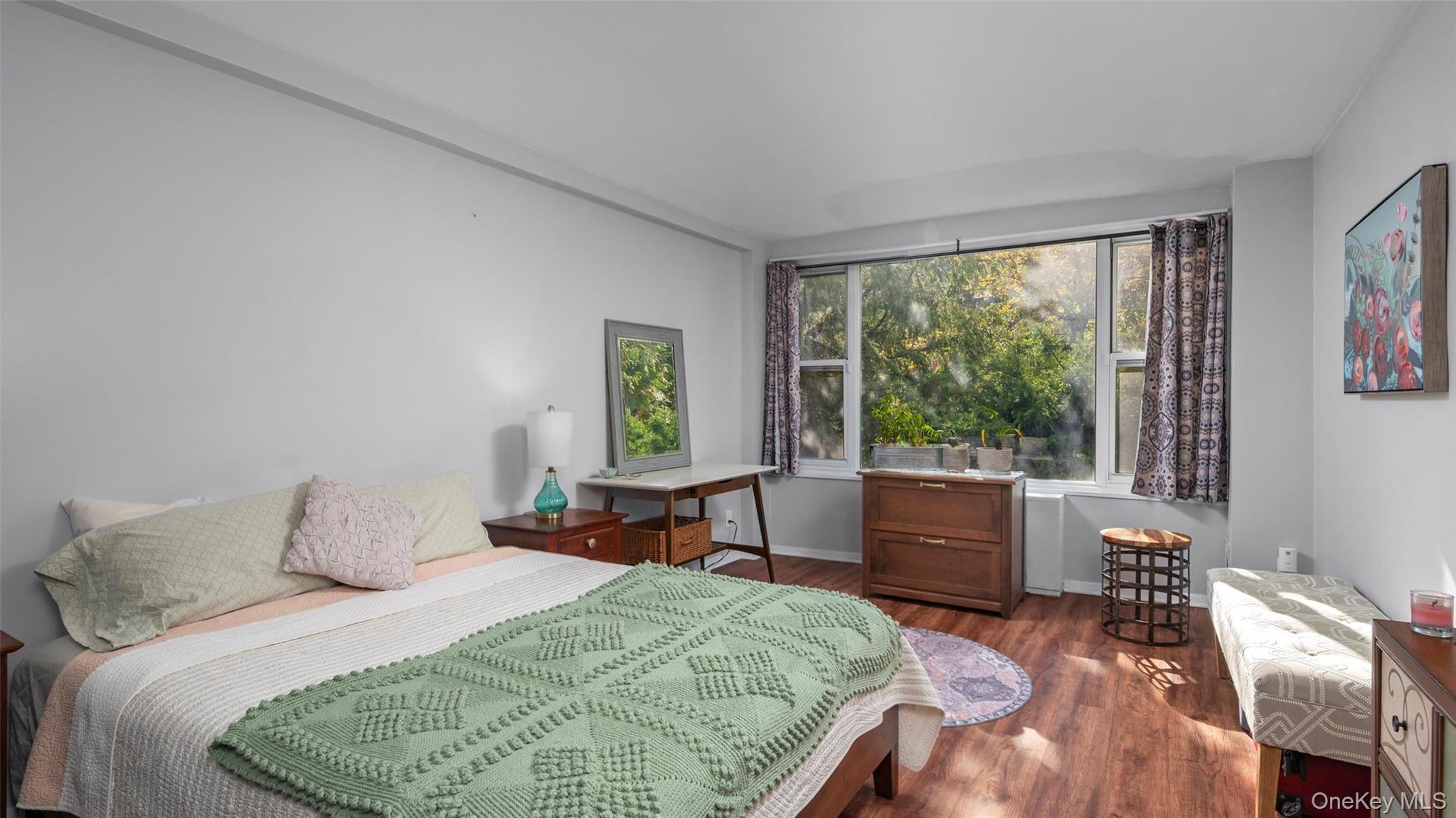 20 Old Mamaroneck Road, Unit 2D White Plains, NY 10605 - Photo 11 of 22 a bedroom with a bed and a window