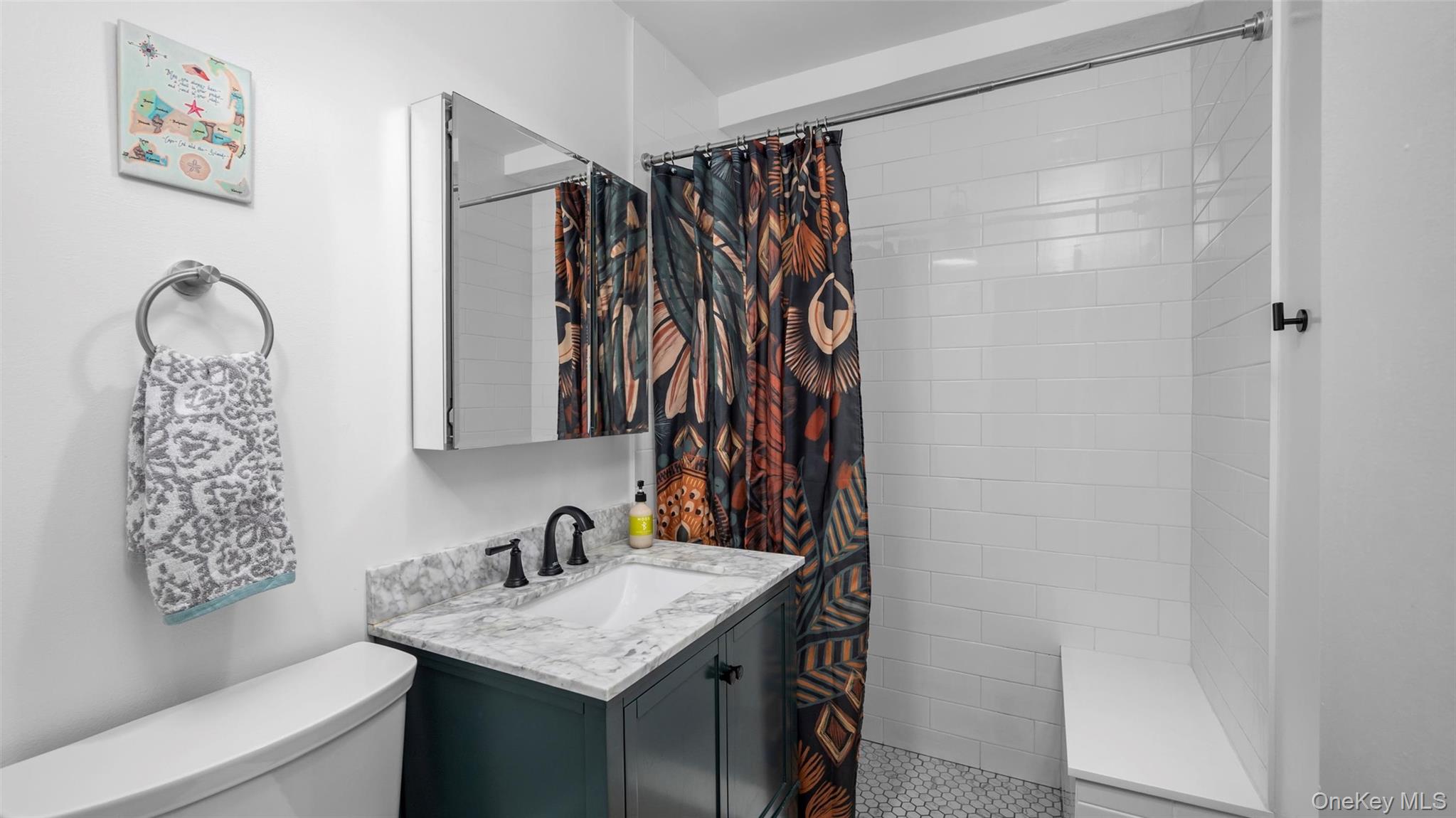 20 Old Mamaroneck Road, Unit 2D White Plains, NY 10605 - Photo 14 of 22 a bathroom with a granite countertop sink a toilet and a shower curtain