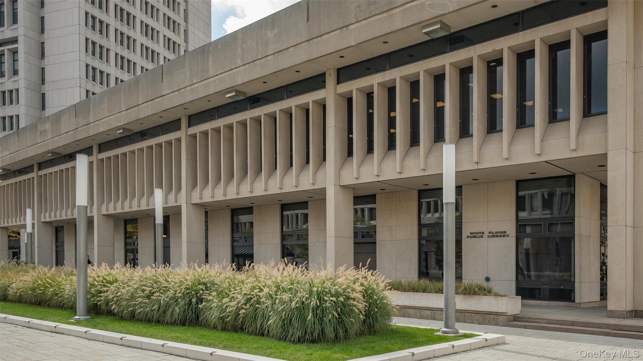 20 Old Mamaroneck Road, Unit 2D White Plains, NY 10605 - Photo 20 of 22 a view of a brick house with many windows