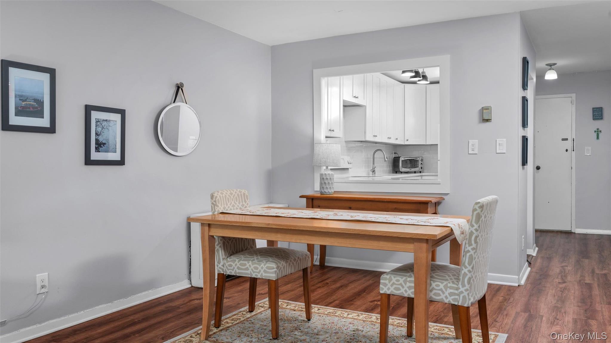 20 Old Mamaroneck Road, Unit 2D White Plains, NY 10605 - Photo 7 of 22 a view of a dining room with furniture and wooden floor