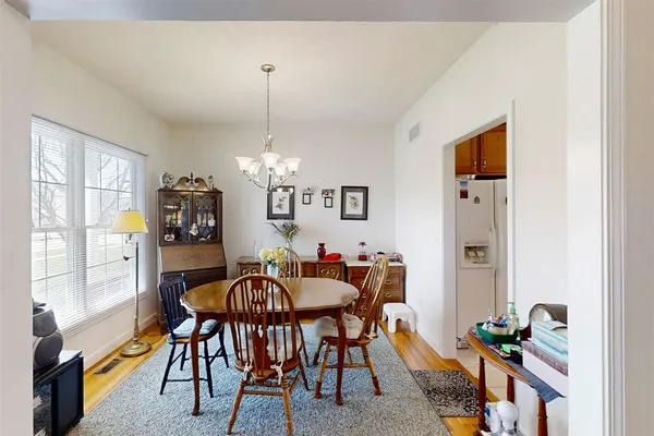 a view of a dining room with furniture window and outside view