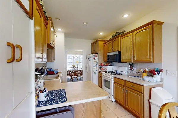 a kitchen with a sink appliances and cabinets