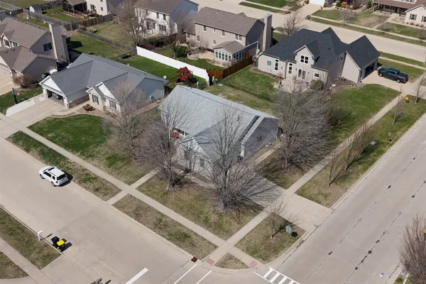 an aerial view of residential houses with outdoor space