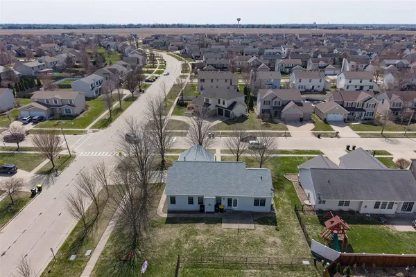 an aerial view of a house with a swimming pool
