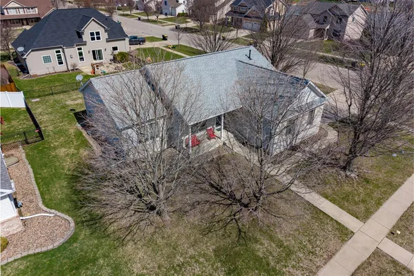 a aerial view of a house with a yard