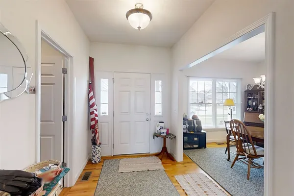 a view of a livingroom with workspace and a window