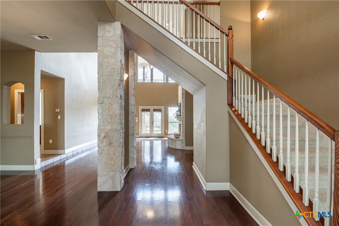 451 Winding View New Braunfels, TX 78132 - Photo 13 of 47 a view of staircase with wooden floor and a chandelier