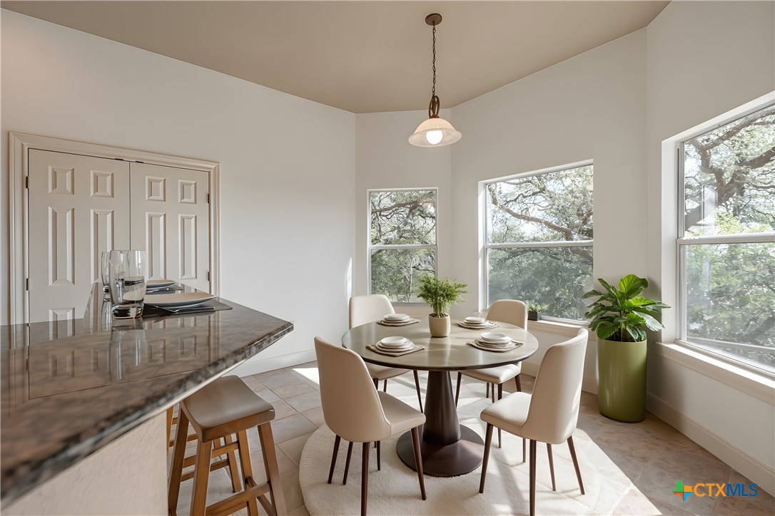 451 Winding View New Braunfels, TX 78132 - Photo 16 of 47 a view of a dining room with furniture window and outside view
