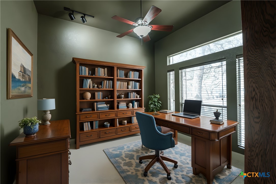 451 Winding View New Braunfels, TX 78132 - Photo 18 of 47 a view of a workspace with furniture and a bookshelf