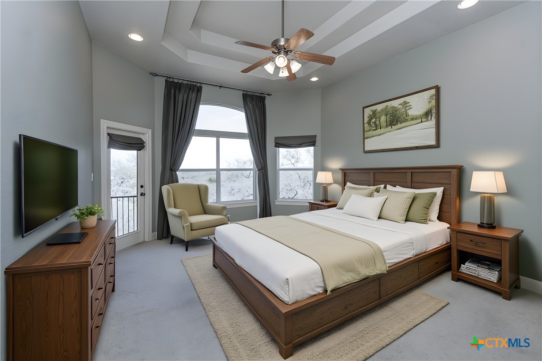 451 Winding View New Braunfels, TX 78132 - Photo 21 of 47 a bedroom with a bed a couch and a flat tv screen on dresser