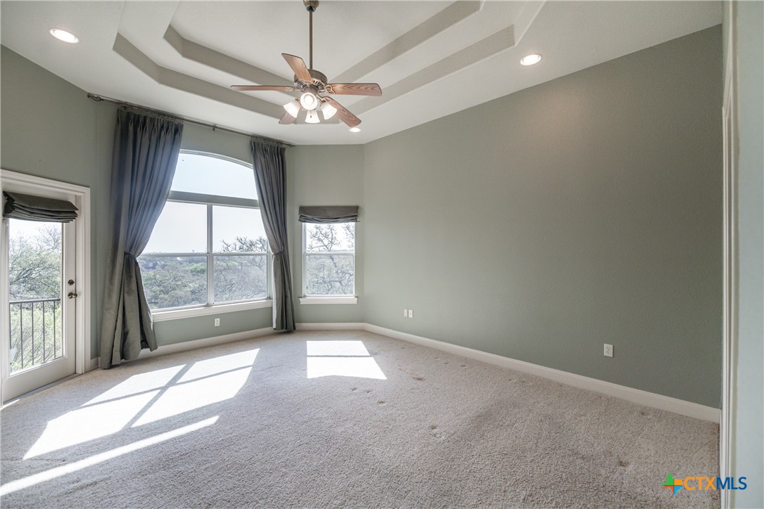 451 Winding View New Braunfels, TX 78132 - Photo 22 of 47 an empty room with windows and outdoor view