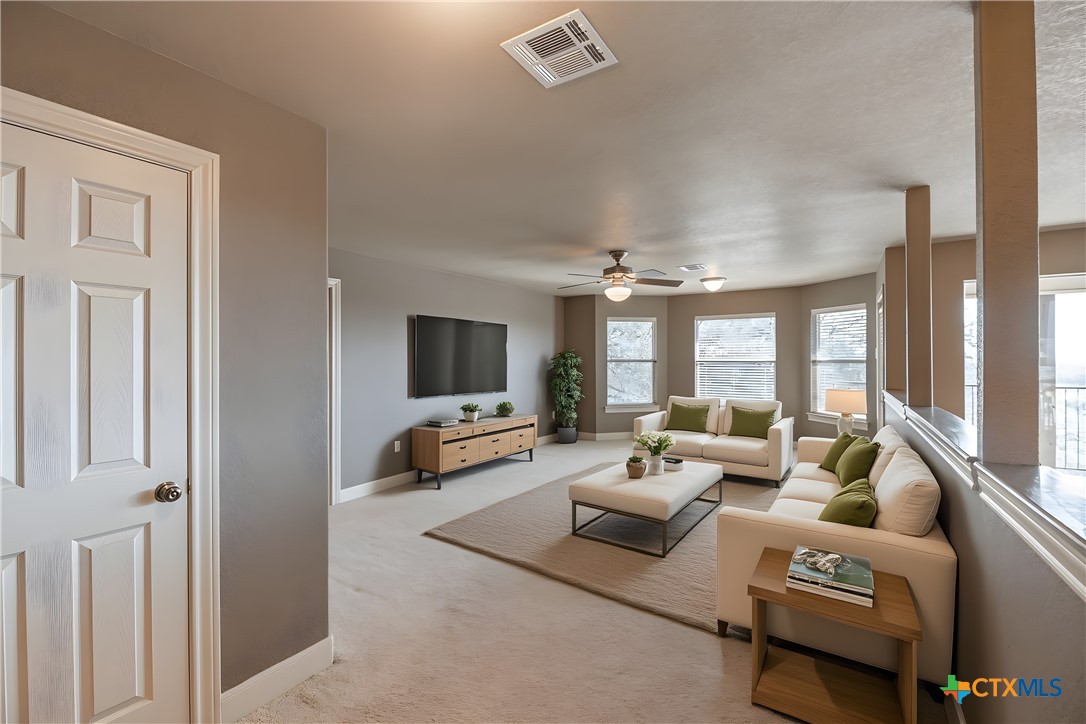 451 Winding View New Braunfels, TX 78132 - Photo 31 of 47 a living room with furniture and a flat screen tv