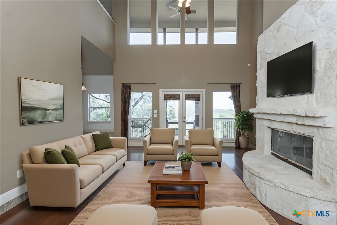 451 Winding View New Braunfels, TX 78132 - Photo 7 of 47 a living room with furniture fireplace and flat screen tv