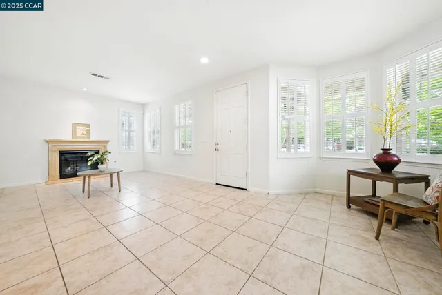 a spacious bathroom with a glass door shower and a sink