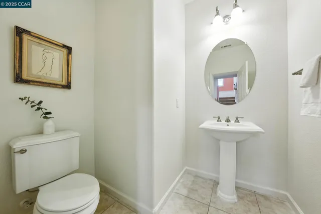 a view of an empty room with window and cabinet