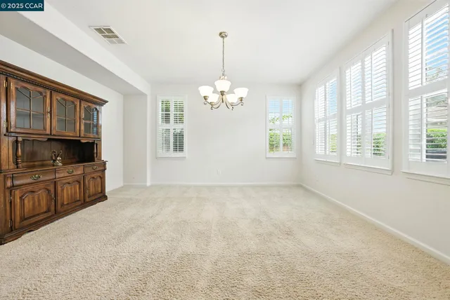 a view of a kitchen with a sink and microwave