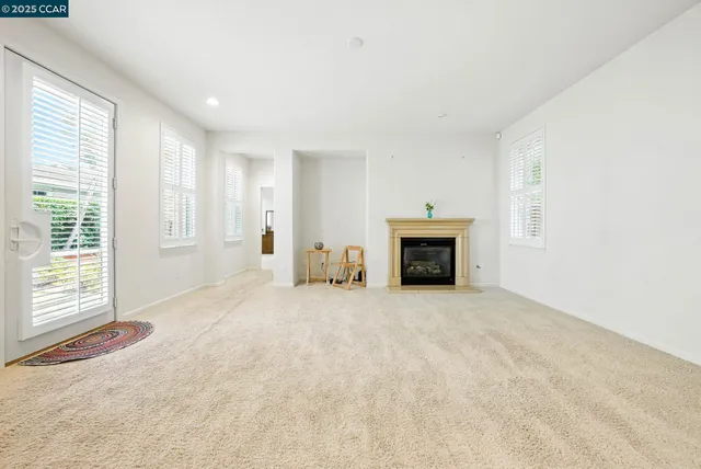 a view of kitchen with furniture and a refrigerator