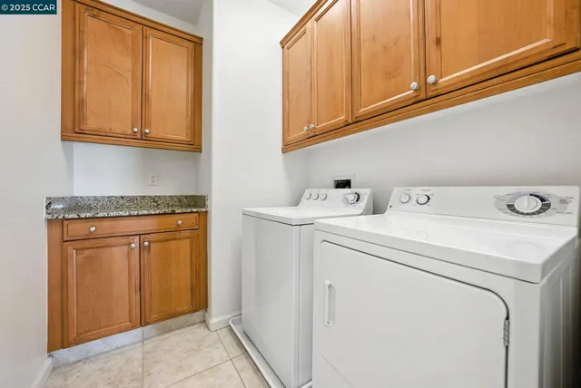 a front view of a house with plants