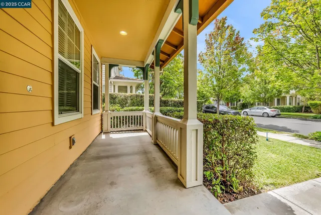a front view of a house with a street
