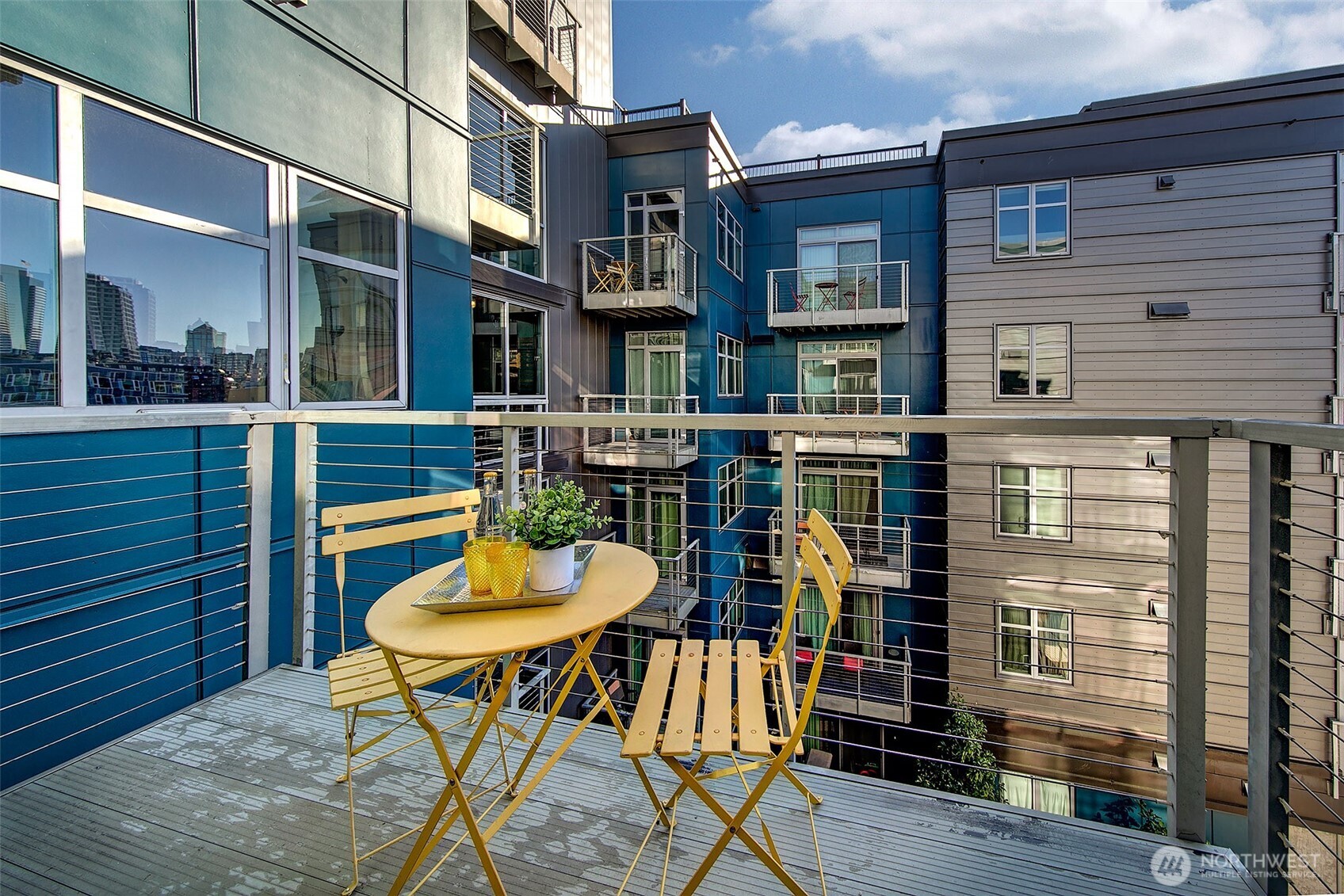 1414 12th Avenue, Unit 504 Seattle, WA 98122 - Photo 16 of 23 a view of a chairs and a table in the balcony