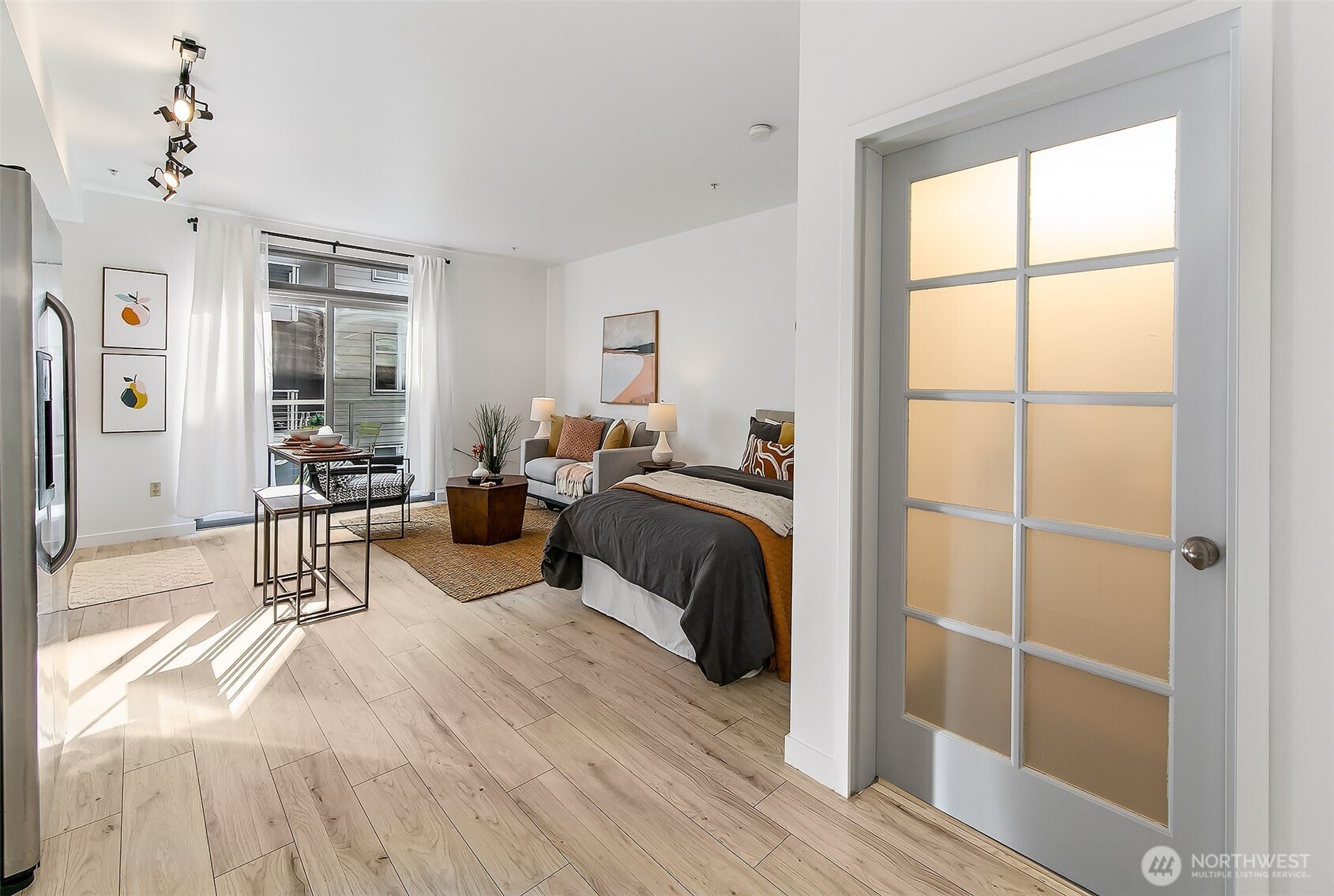 1414 12th Avenue, Unit 504 Seattle, WA 98122 - Photo 6 of 23 a bedroom with furniture and a window