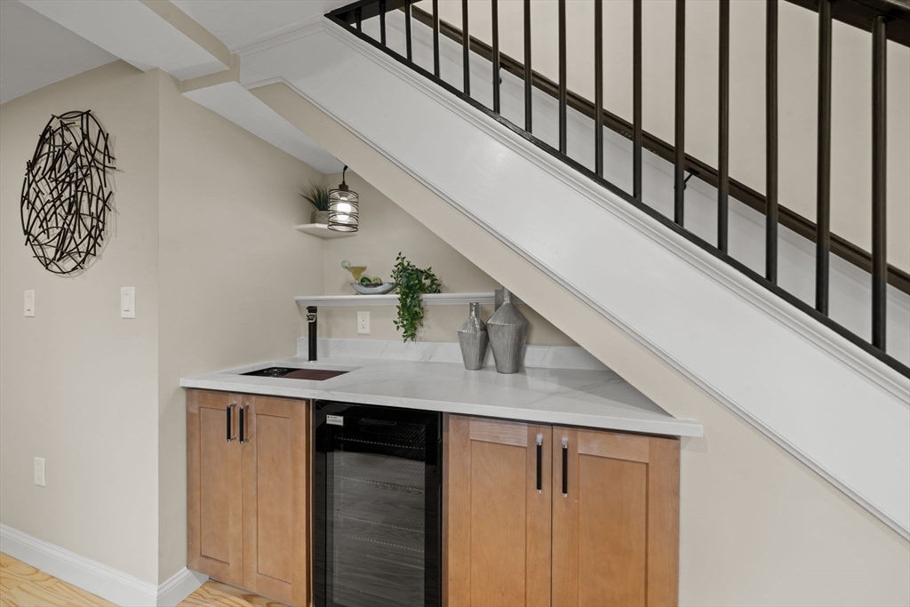 162 High Street, Unit B Danvers, MA 01923 - Photo 11 of 32 a view of entryway and hall with wooden floor