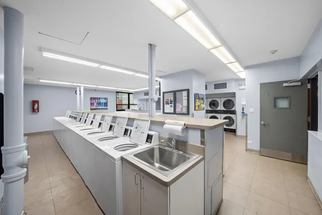 a kitchen with stainless steel appliances granite countertop a sink and stove