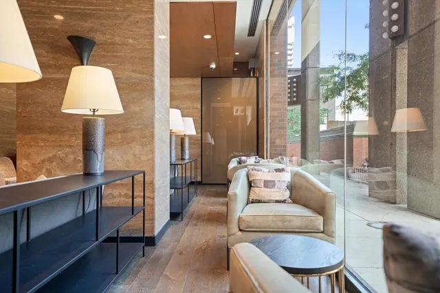 a living room with furniture and a lamp