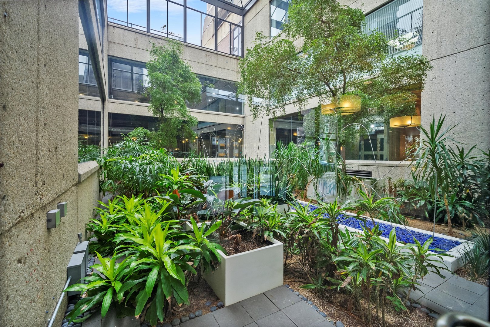 1030 North State Street, Unit 39A Chicago, IL 60610 - Photo 4 of 36 a view of a house with a flower garden
