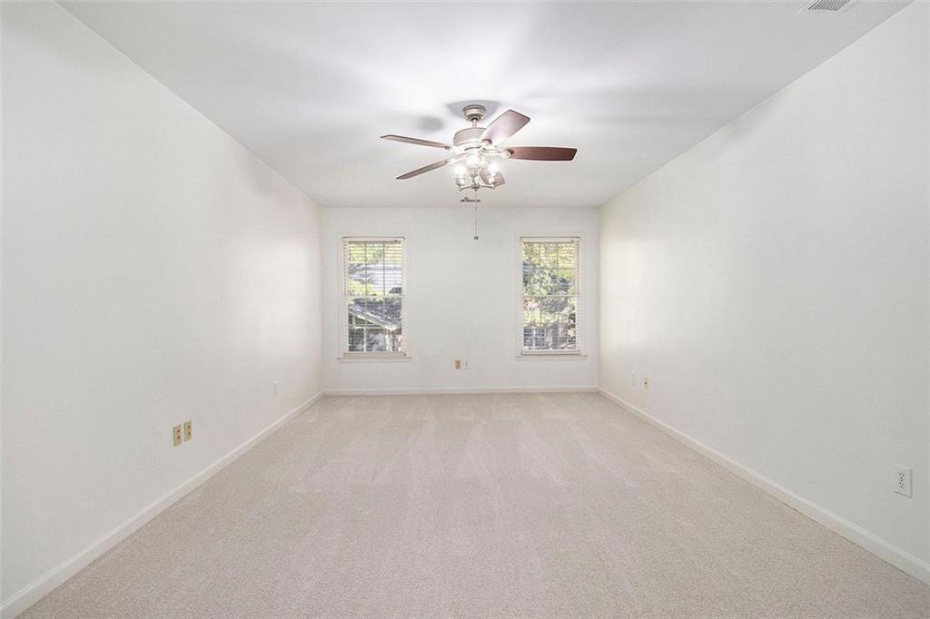 2520 Summeroak Drive Tucker, GA 30084 - Photo 20 of 37 an empty room with windows and fan