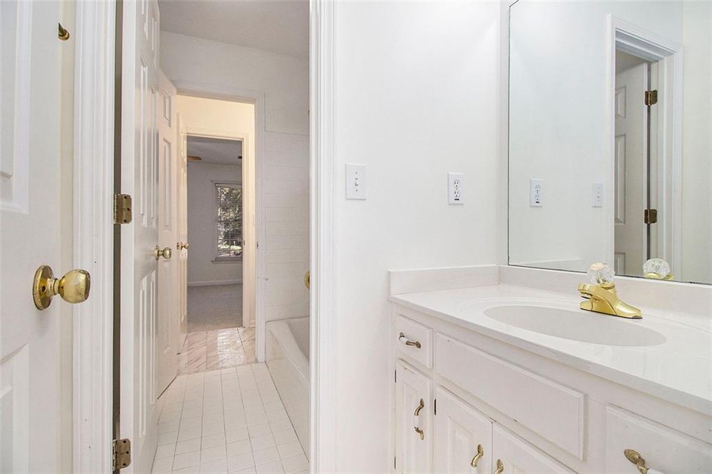 2520 Summeroak Drive Tucker, GA 30084 - Photo 24 of 37 a bathroom with a sink and a mirror