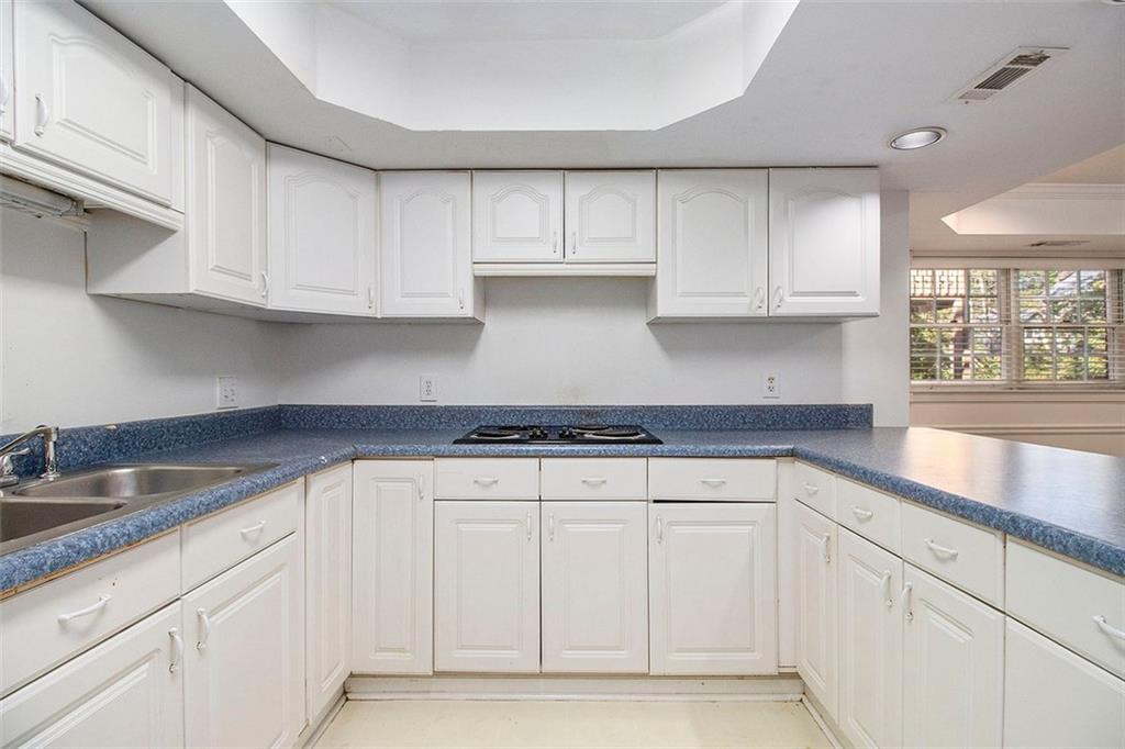 2520 Summeroak Drive Tucker, GA 30084 - Photo 30 of 37 a kitchen with white cabinets and a sink