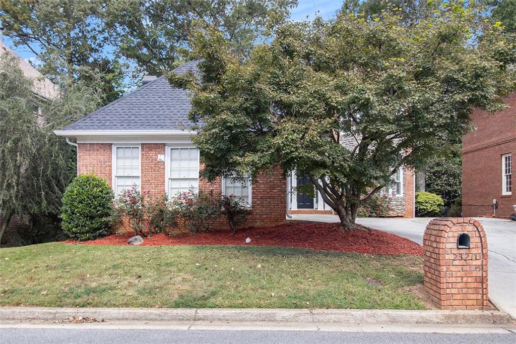 2520 Summeroak Drive Tucker, GA 30084 - Photo 3 of 37 a front view of a house with garden